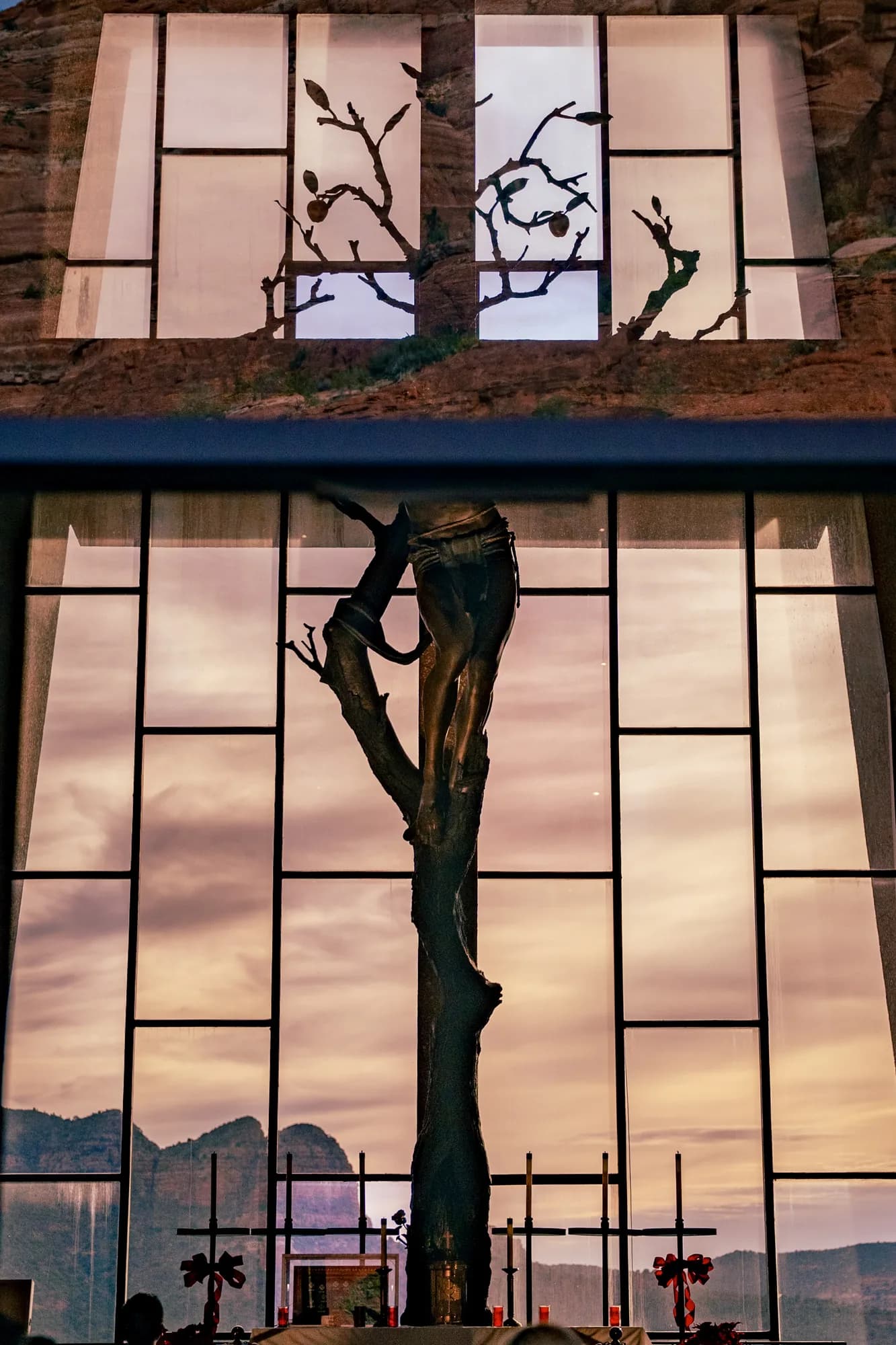 Sculpture against a chapel window