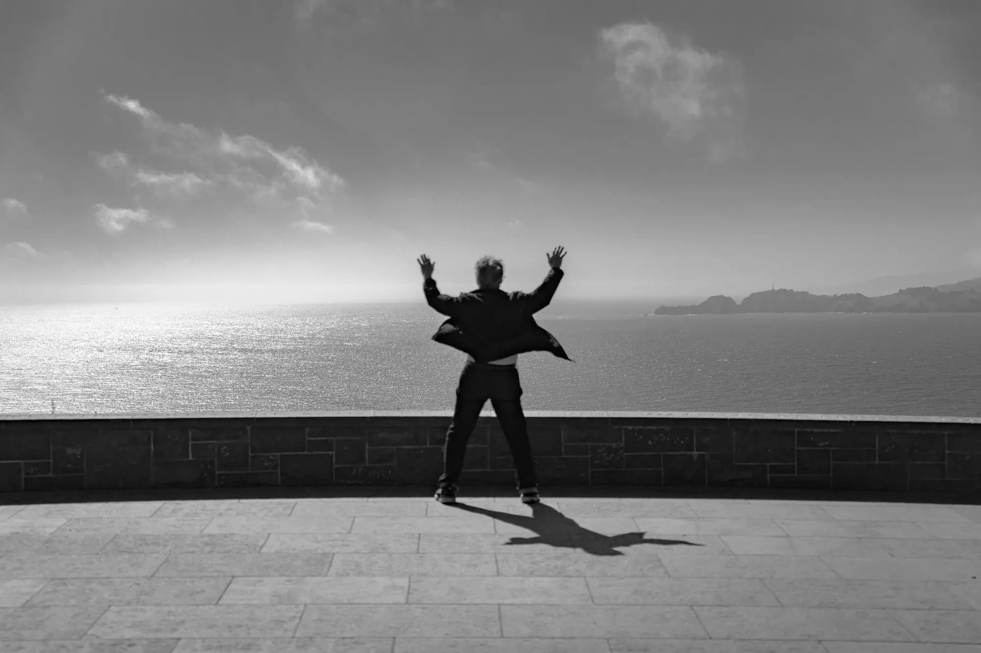 Arms raised above the bay
